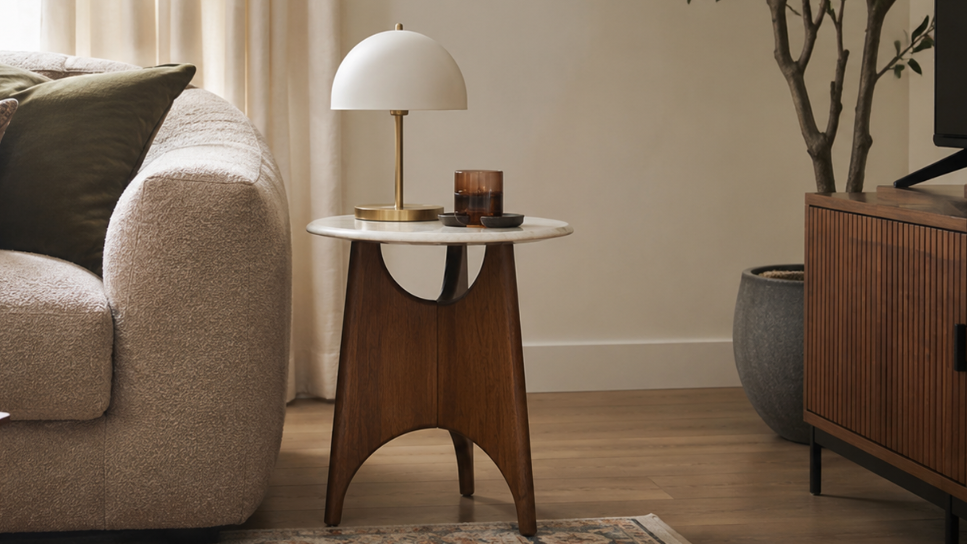 Best End Tables that Speak to Your Personal Style: Modern, Midcentury, Boho, Cottagecore, and Y2K end table next to a sofa